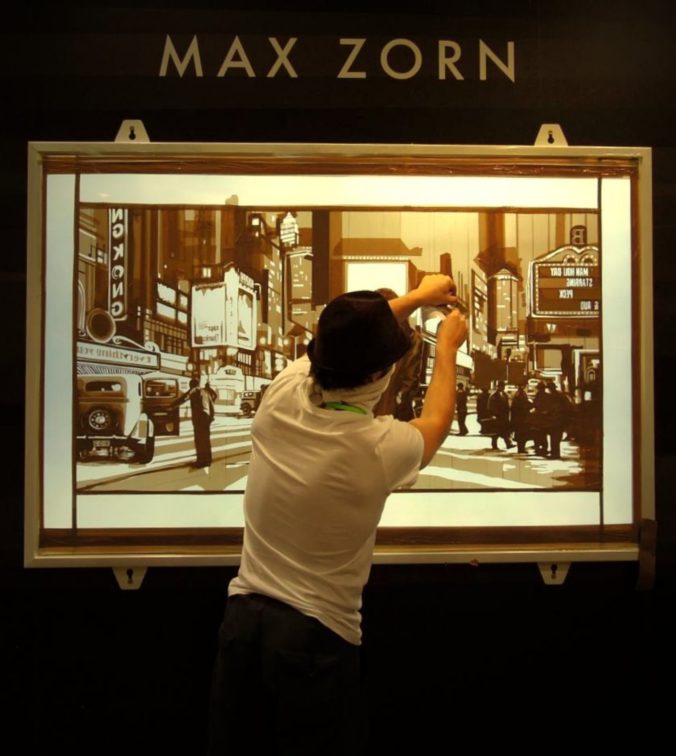 Max Zorn at Art Basel Hong Kong creating a live artwork with packing tape