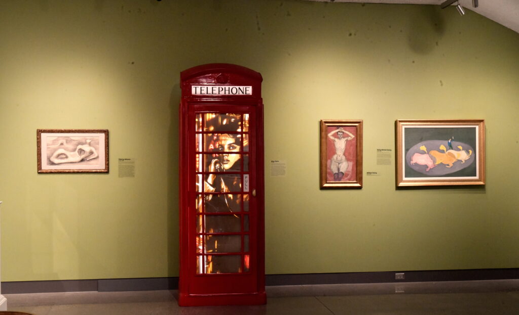 Illuminated tape artwork by Max Zorn displayed inside a red British telephone booth