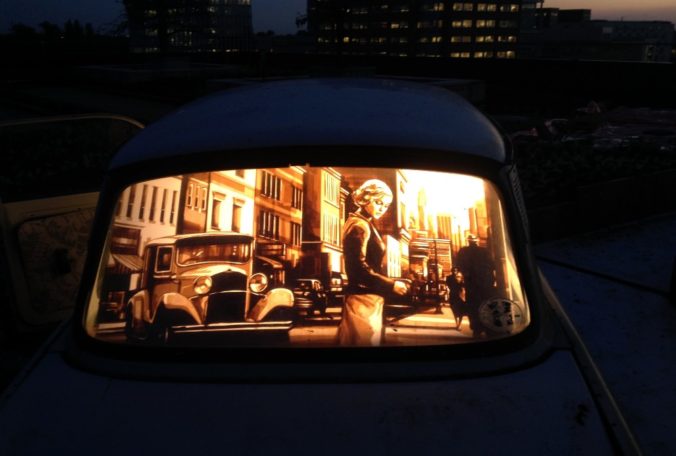 Tape artwork installed in a car by Max Zorn. Installation on roof top in Amsterdam. Kunst mit Klebeband installiert in ein Auto. Street art at night.